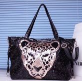 Bolsa Paetê Onça