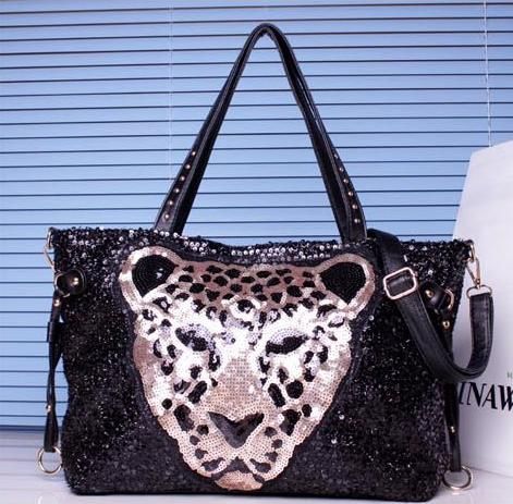 Bolsa Paetê Onça